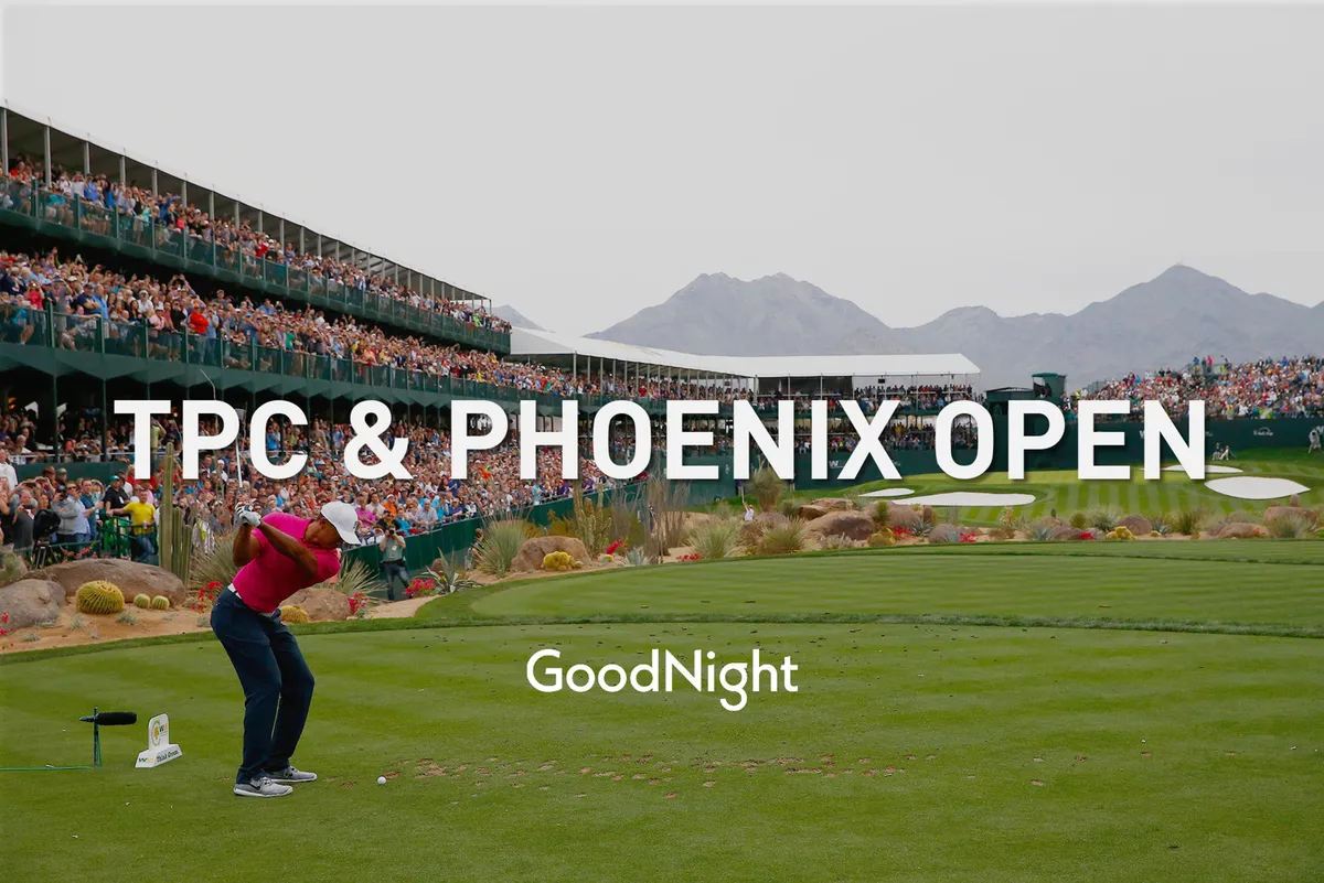 A dynamic scene at a golf course with a player about to swing, a crowd watching, and mountains in the background, all under a bright sky. The energy of a live tournament or event is palpable, capturing the excitement and social aspect of golf in Scottsdale.