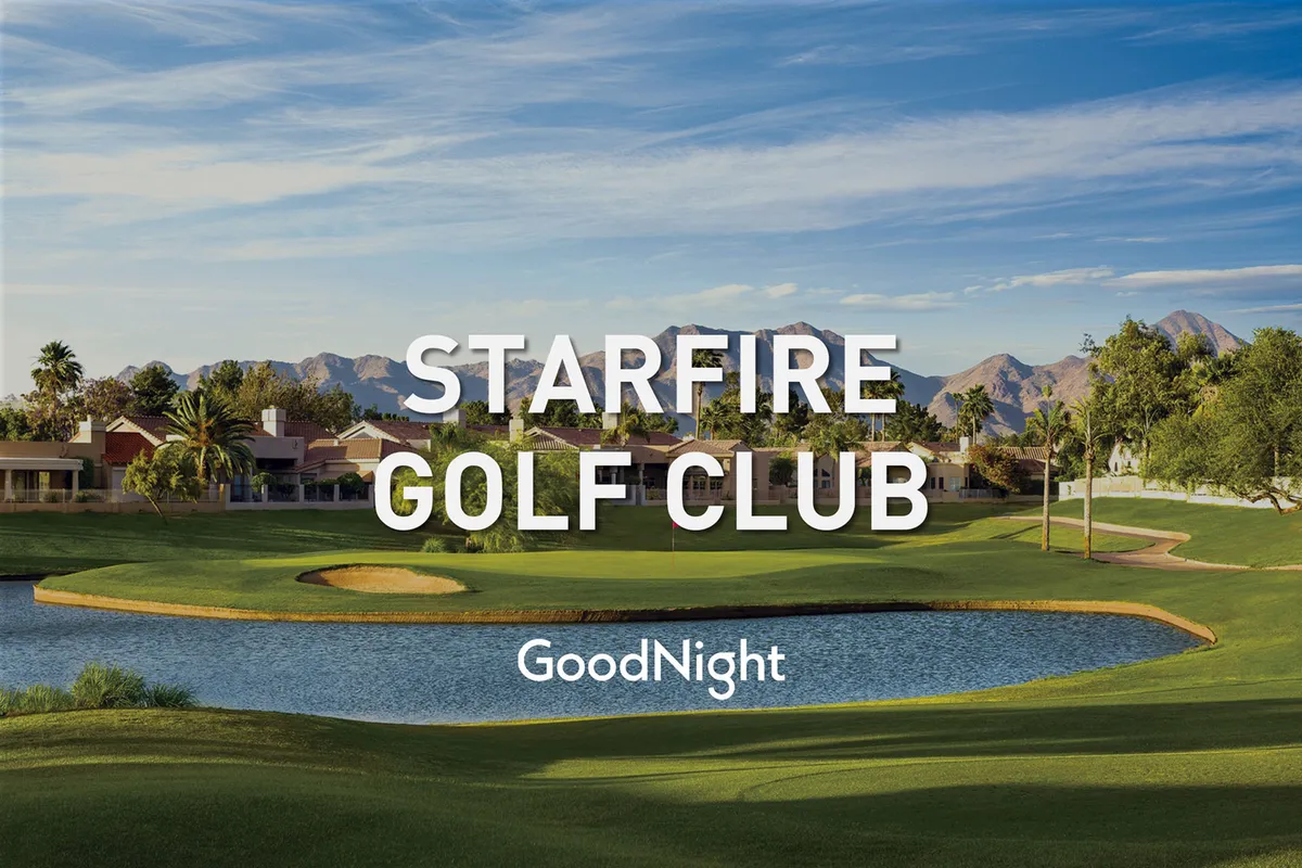 A sweeping view of a nearby premier golf course with lush greens, a reflective lake, palm trees, and mountains in the background. The scene highlights opportunities for offsite recreation and team-building activities, connecting the property to the local Scottsdale experience.